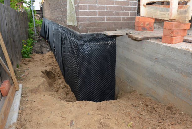 Happy homeowners after waterproofing job in Saint Francis